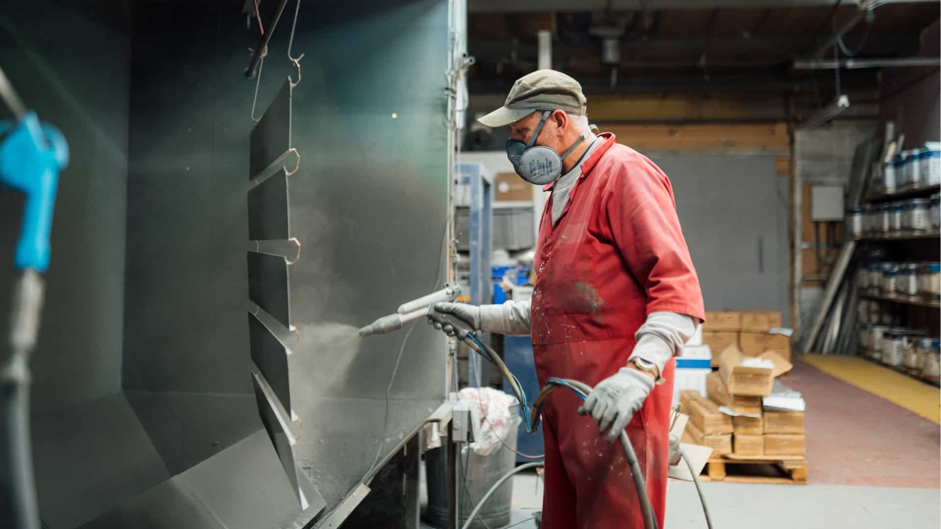Skilled worker operating machinery in a manufacturing facility.